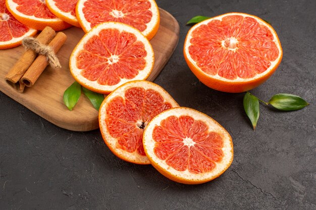 Front view fresh grapefruit slices on the dark table