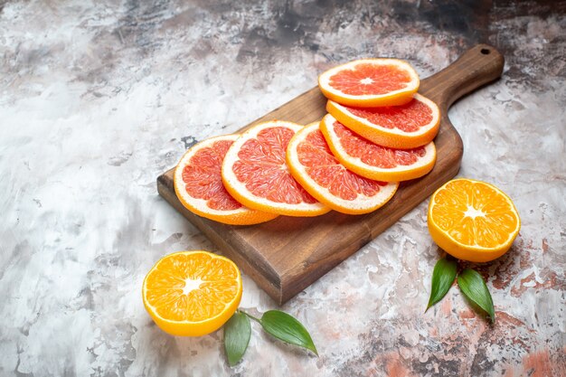 Front view fresh grapefruits sliced fruits on light-table