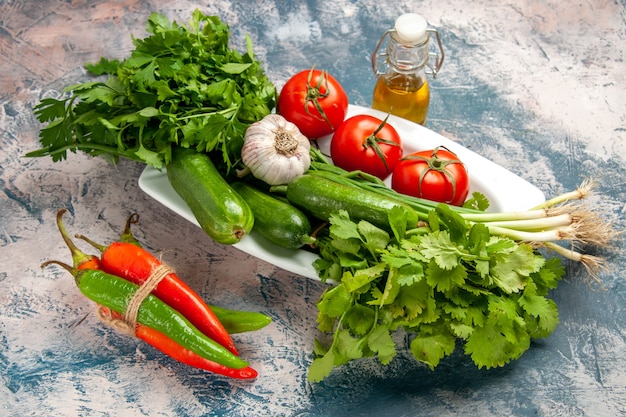 Front view fresh green onion with tomatoes and greens on light-blue background color photo ripe meal salad