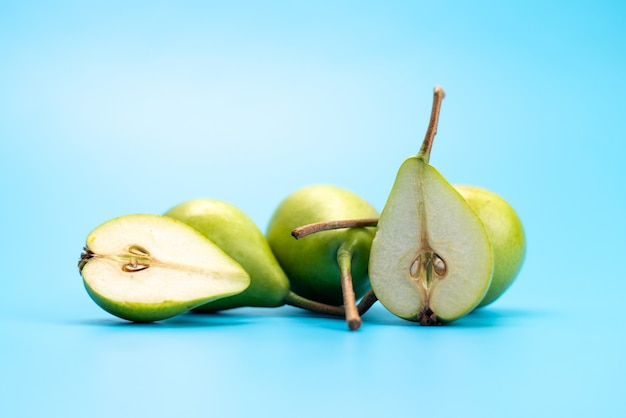 Free photo a front view fresh green pears sweet and mellow on blue, fruit color ripe