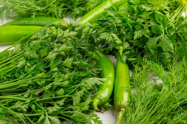 Free photo front view fresh greens with peppers on white background food diet salad healthy life photo meal color