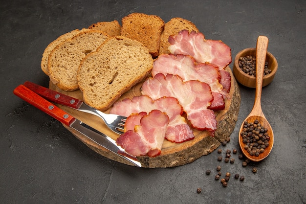 Free photo front view fresh ham slices with buns and bread slices on a dark snack meat color photo food meal