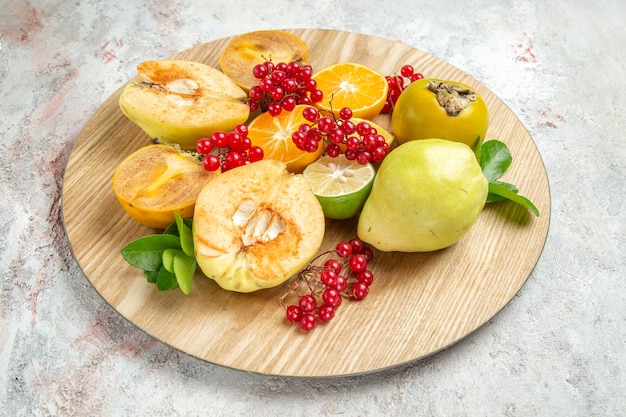 Free Photo front view fresh quinces with other fruits on white table fruit mellow fresh ripe