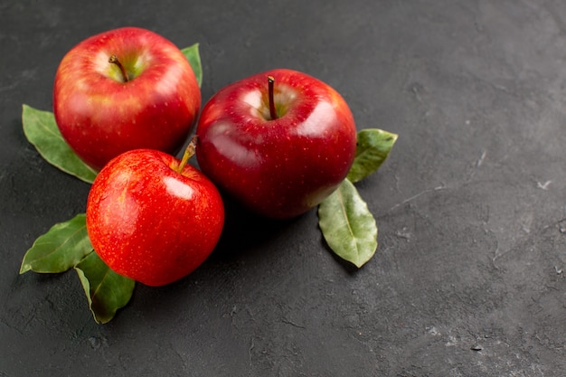 Free photo front view fresh red apples mellow fruits on dark table fruit red fresh ripe