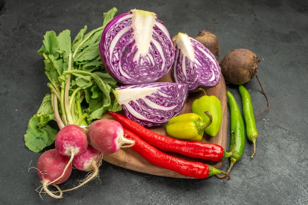 Front view fresh red cabbage with other vegetables on dark table salad diet health ripe