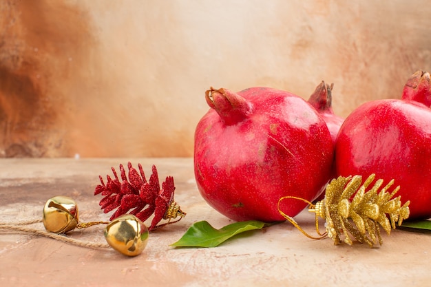 Front view fresh red pomegranates on light background color fruits photo mellow juice