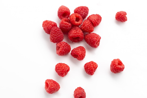 Free photo front view fresh red raspberries mellow and sour on white