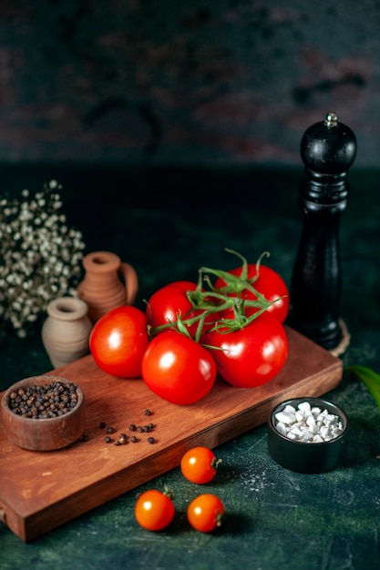 front view fresh red tomatoes on dark background