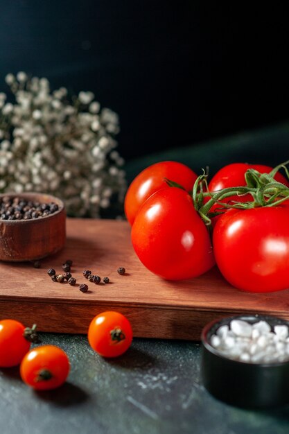 front view fresh red tomatoes on dark background