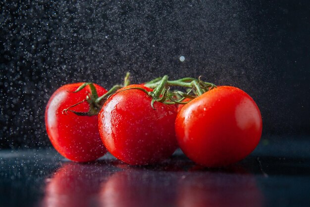 Front view fresh red tomatoes on dark