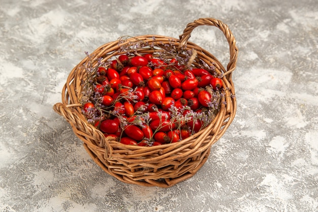 Free Photo front view fresh sour dogwoods inside basket on white desk