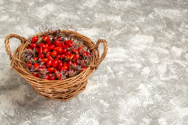 Free Photo front view fresh sour dogwoods inside basket on the white surface