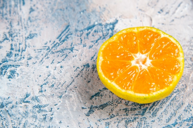 Front view fresh tangerine slice on a light-blue table