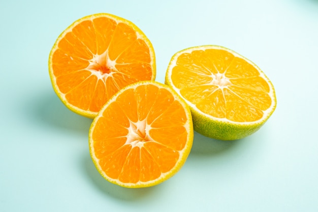 Front view fresh tangerine slices on a light-blue table