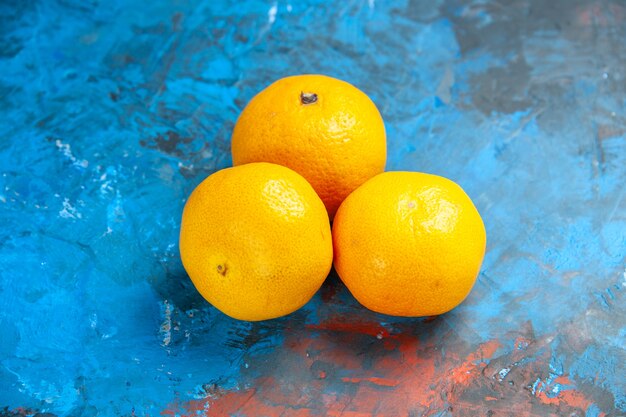 Front view fresh tangerines on blue table