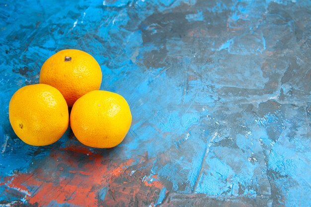 Front view fresh tangerines on the blue table