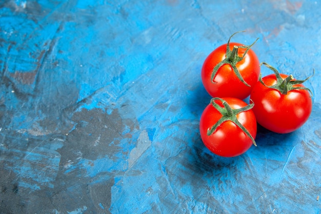 Front view fresh tomatoes on a blue table