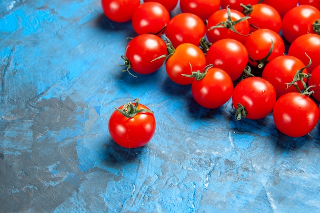 Front view fresh tomatoes on blue table