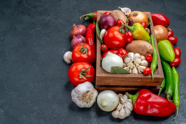 Front view fresh vegetables composition on a grey table ripe salad fresh color