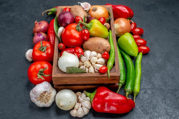 Front view fresh vegetables composition on grey table salad fresh ripe color