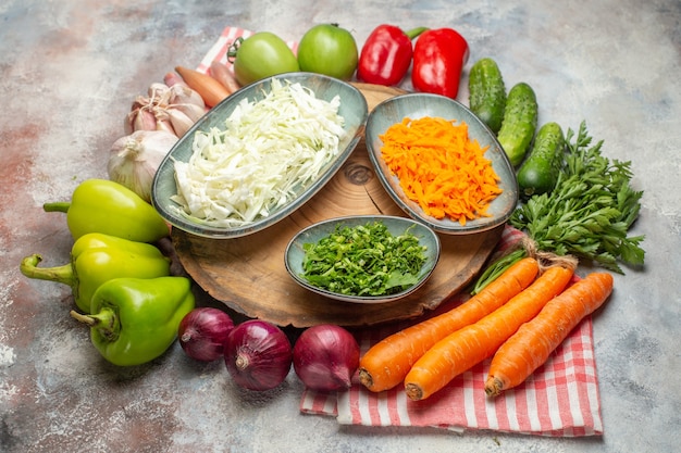 Front view fresh vegetables composition sliced and whole vegetables on white background color ripe healthy life diet salad