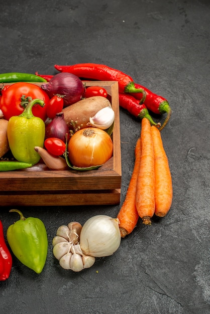 Free photo front view fresh vegetables with pepper and garlic on dark table ripe salad color