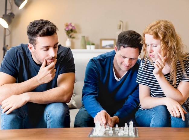 Free Photo front view of friends playing chess