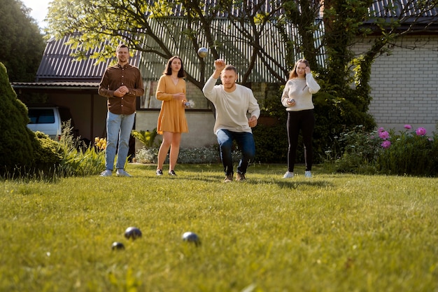 Free photo front view friends playing sport