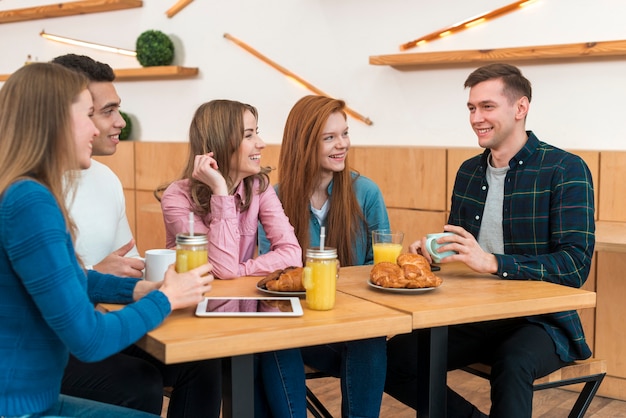 Free Photo front view of friends spending time together