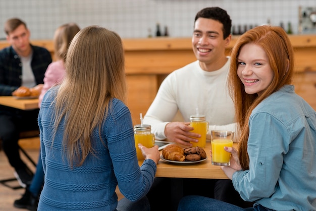 Free Photo front view of friends spending time together