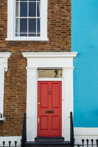 Front view of front door with blue and brown wall