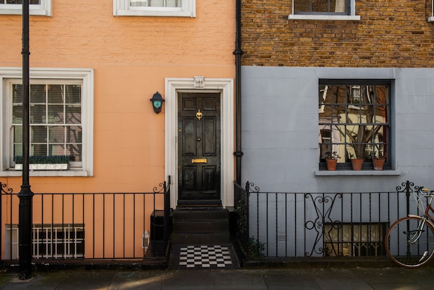 Front view of front door with orange and blue wall