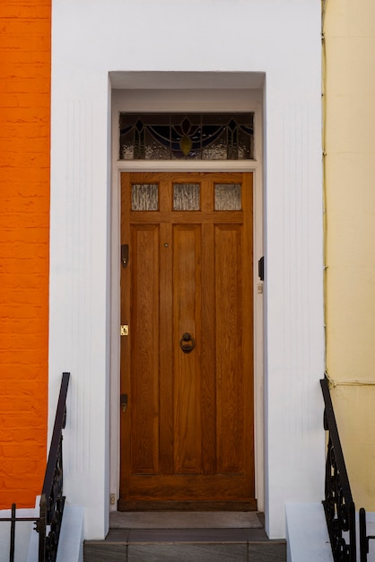 Front view of front door with orange wall