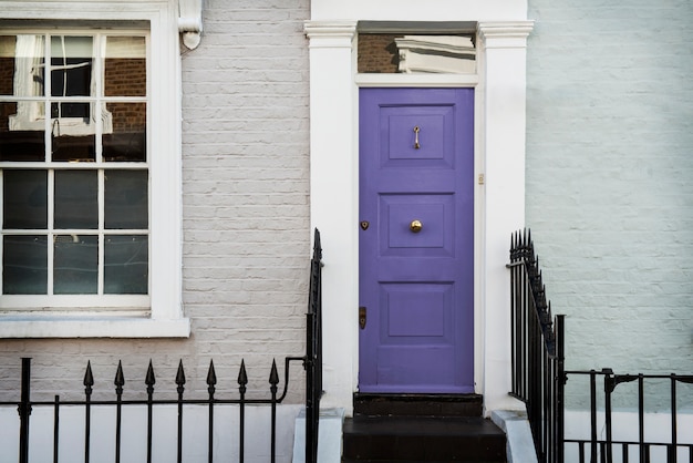 Free photo front view of front door with white and blue wall