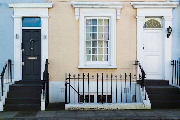 Front view of front doors with blue and orange wall