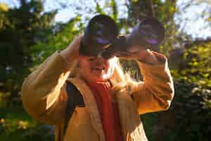 Free photo front view girl exploring nature