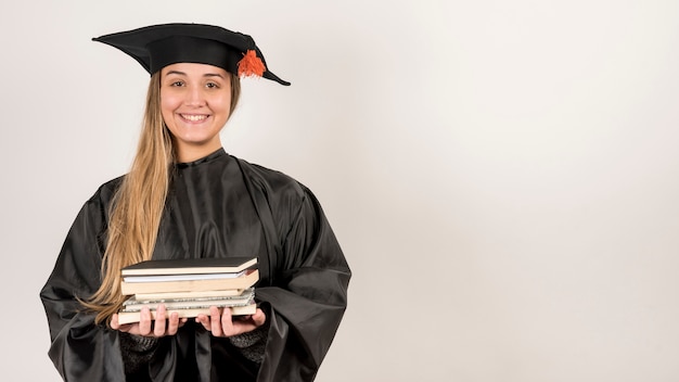 Free photo front view girl graduating with copy space