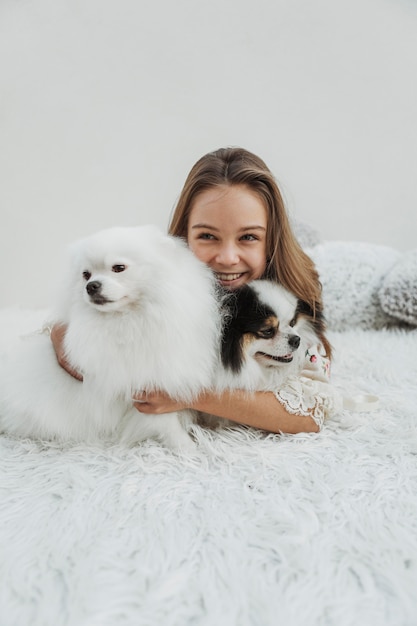 Free Photo front view girl and her dogs