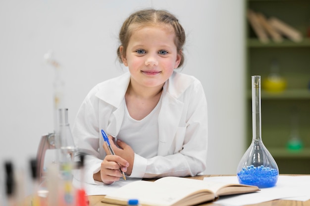 Front view girl learning science