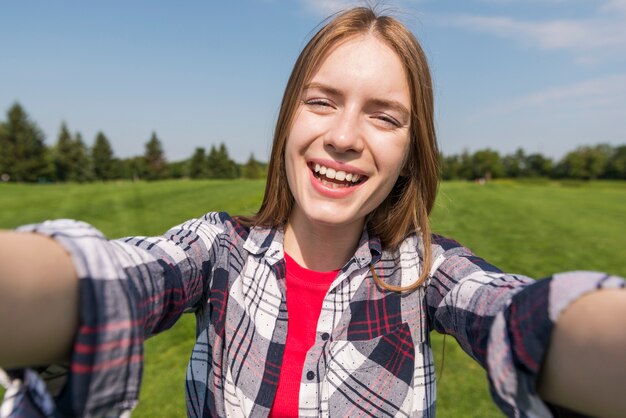 Free Photo front view girl taking a selfie