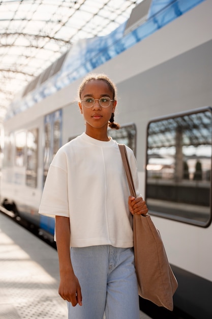 Free Photo front view girl traveling by train