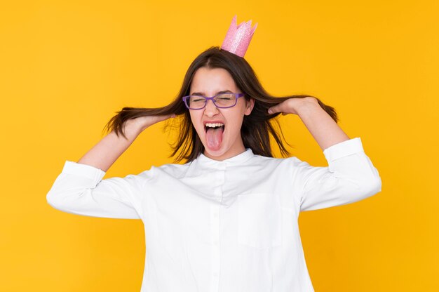 Front view of girl wearing a crown with copy space