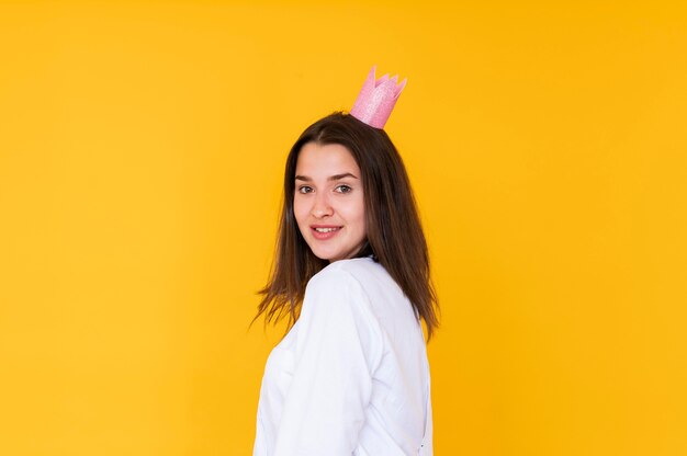 Front view of girl wearing a crown with copy space