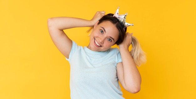 Front view of girl wearing a crown with copy space