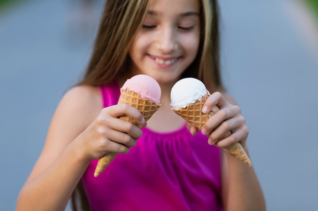 Front view of girl with ice cream cones