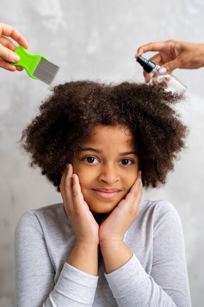 Front view girl with spray treatment