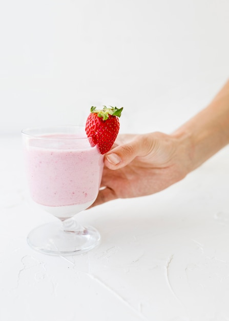 Front view glass filled with strawberry smoothie