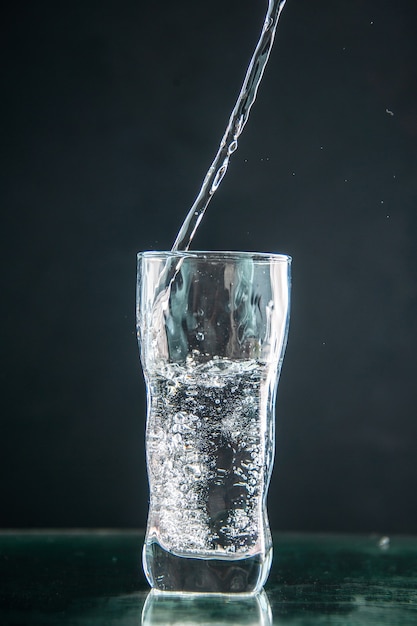 Front view glass of soda on dark drink photo color champagne xmas water