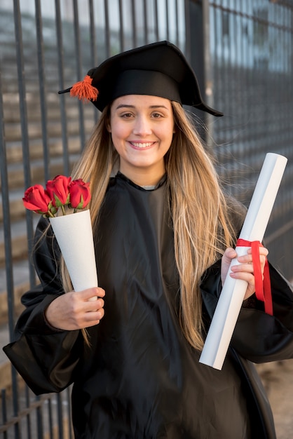 Front view graduate with bouquet of roses 