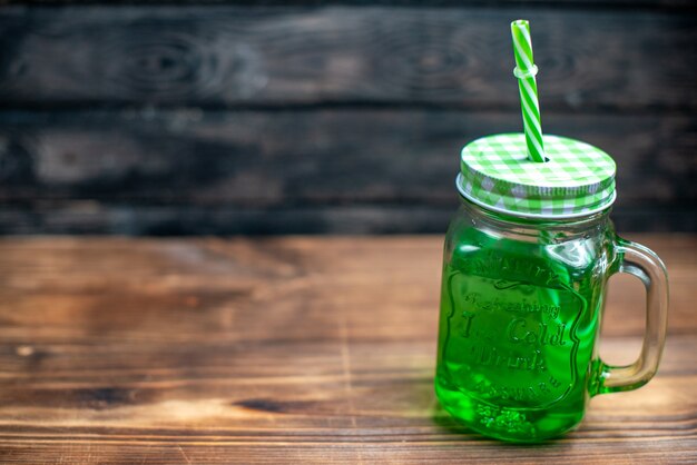 Front view green apple juice inside can on wooden desk drink photo cocktail color fruit